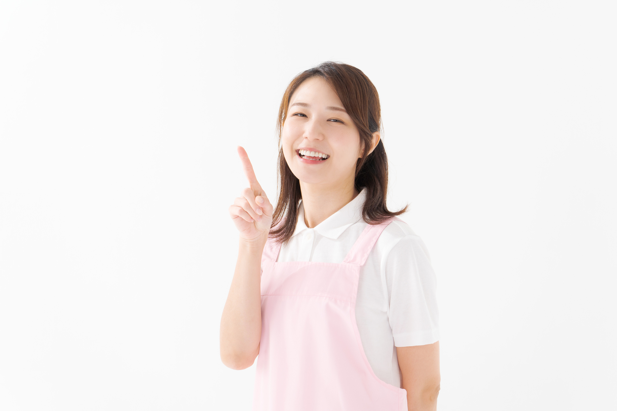 人差し指を立ててポイントを示す介護職員